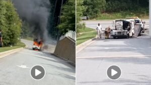 On the left, a vehicle is engulfed in flames, emitting thick black smoke on a street lined with trees. On the right, a group of people is gathered around another vehicle, which appears to be opened up for examination, on a nearby road.