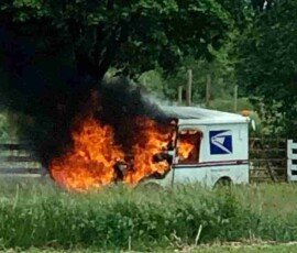 Mail truck catches on fire in Frankenmuth, Michigan after driver hits a tree